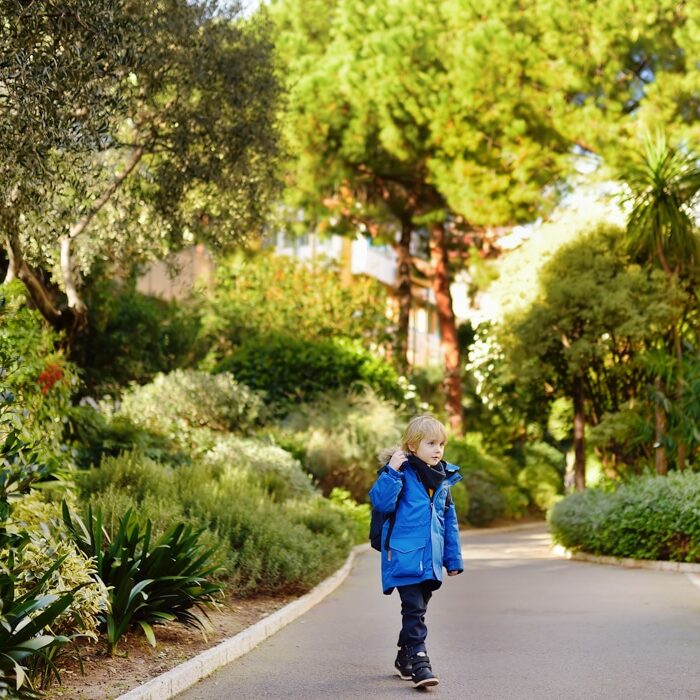 child walking in a park in Monaco