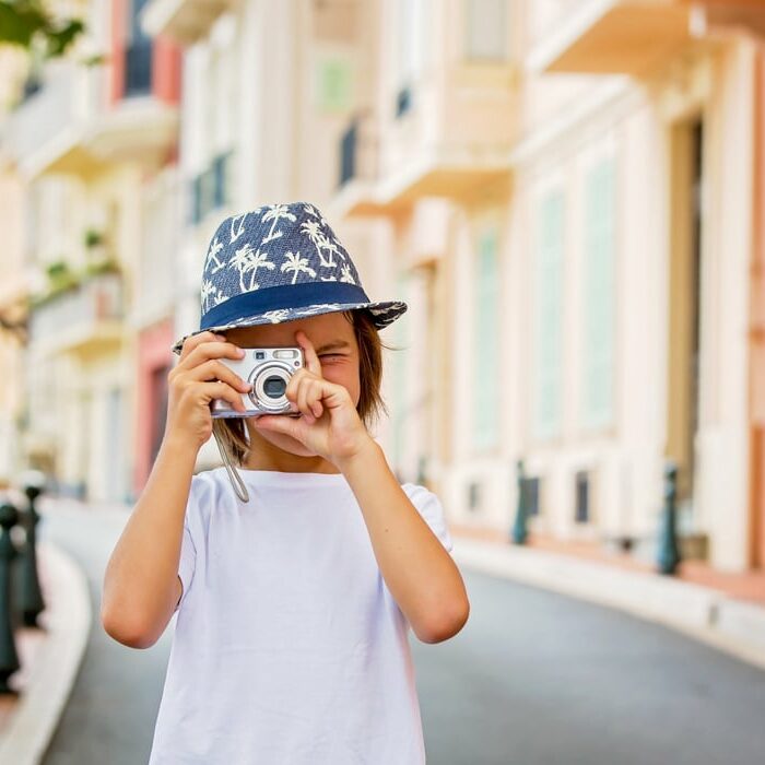 Child taking photos of the streets in Monaco
